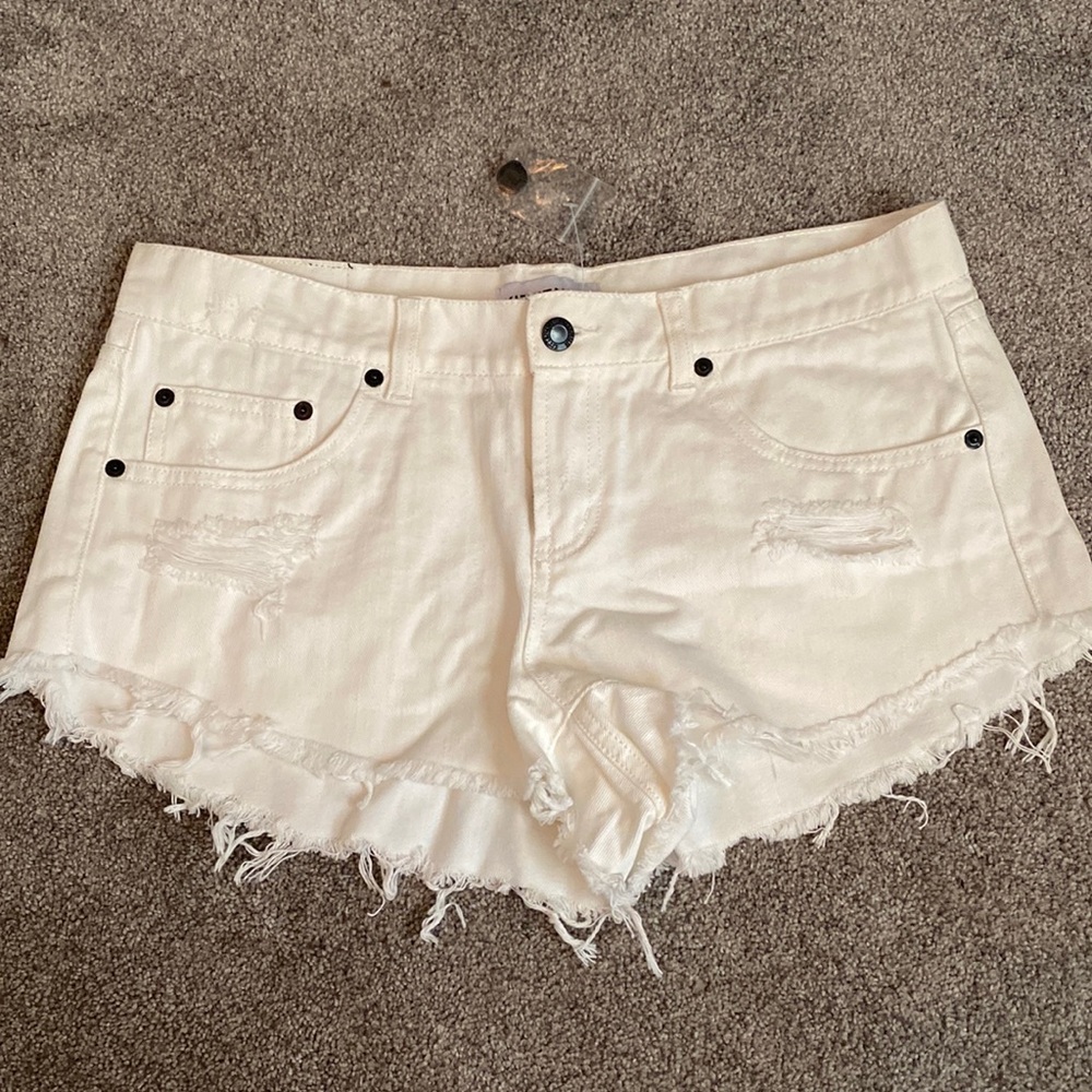 White ripped jean shorts